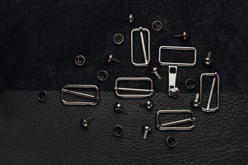 black leather background with fittings