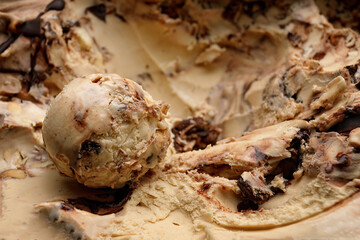 A scoop of Creme brulee ice cream with chocolate close-up