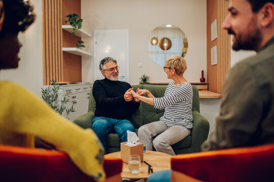 Senior people talking about their mental health on a group therapy session