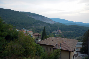 An old mountain quarry and a small town near it in a picturesque valley