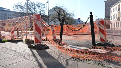 Row of reflective orange construction cones, at a street construction site, orange traffic cones...