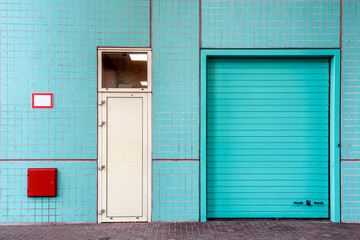 Urban architectural detail with industrial facade and blue tiles