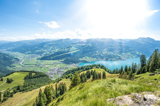 Panoramic view of meadow, Walenstadt, lake Walensee and the Swiss Alps. Schn&uuml;rliweg, Walensee, St. Gallen, Switzerland, Europe.