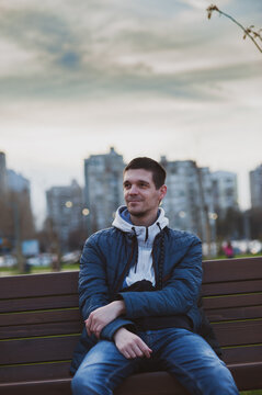 An average guy sitting in the park 