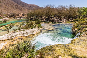 Naklejka na ściany i meble Wadi Darbat Valley, one of the most beautiful and picturesque places of nature in the Dhofar region in the Sultanate of Oman.
