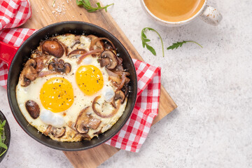 Fototapeta na wymiar Fried egg, mushrooms and red onion.