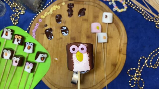 Creative food decoration. Sweet marshmallow penguin Desserts and sweets. High quality 4k footage