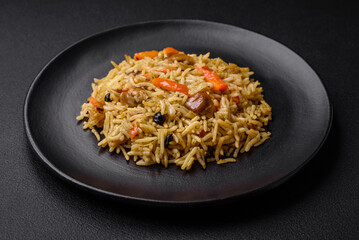 Delicious Uzbek pilaf with chicken, carrots, barberry, spices and herbs