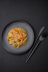 Delicious Uzbek pilaf with chicken, carrots, barberry, spices and herbs