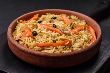 Delicious Uzbek pilaf with chicken, carrots, barberry, spices and herbs