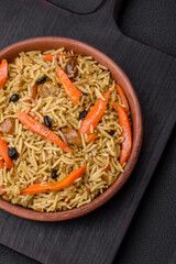 Delicious Uzbek pilaf with chicken, carrots, barberry, spices and herbs