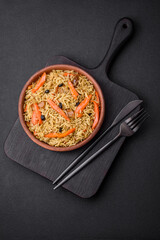 Delicious Uzbek pilaf with chicken, carrots, barberry, spices and herbs