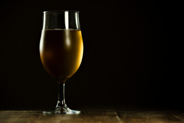 A glass of delicious craft beer served on an authentic beer glass, to be used as a background