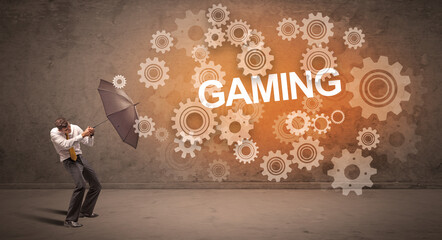 Obraz premium Businessman defending with umbrella concept