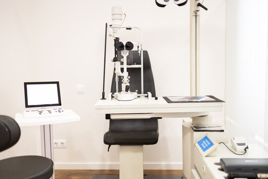 Modern workplace with ophthalmic equipment and monitor in hospital