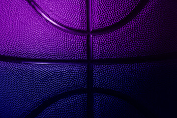Closeup detail of blue and violet basketball ball texture background. Horizontal sport theme...
