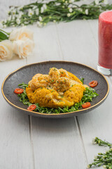 green plantain cooked with shrimp, 
Ecuadorian typical food, tigrillo con salsa de camaron