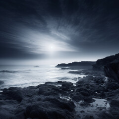 Obraz premium sunset over the ocean with dusk horizon in black and white shoot