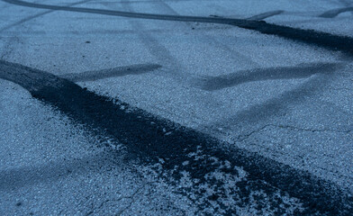 Traces from car tires on the asphalt. Auto sport