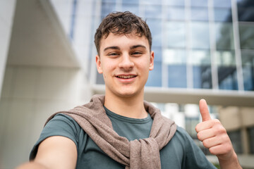 portrait of young Caucasian man teenager 18 or 19 years old outdoor