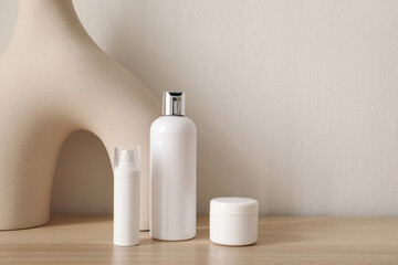 Face and body skin care products on a beige background. Professional cosmetics for skin care. Organic cosmetics. Beauty treatment for women with natural ingredients. Bottle, jar mockup. Copy space.