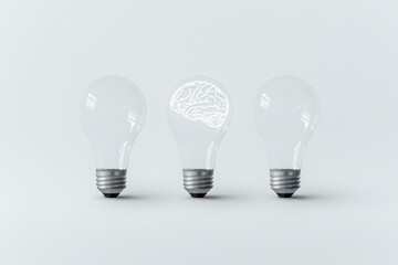 Brain glowing in light bulb.
