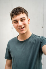 portrait of young Caucasian man teenager 18 or 19 years old outdoor