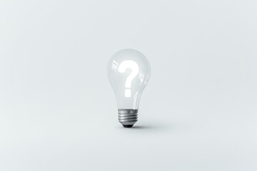 Glowing question mark inside a light bulb.