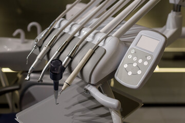 Modern dental unit, instruments and devices for teeth treatment in the dentist's office in...