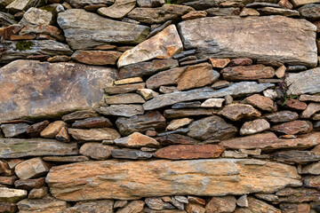 Wall made of various stones - 595703619