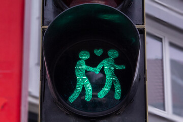 A pedestrian traffic light in support of gay female lesbian couple in Germany. Traffic light...