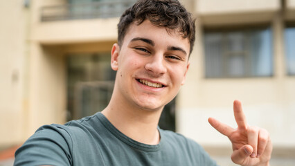 portrait of young Caucasian man teenager 18 or 19 years old outdoor