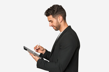 Young businessman excelling in his work, utilizing a tablet with modern technology for enhanced productivity and organization.