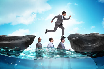 Inequal competition concept with businessman walking on heads