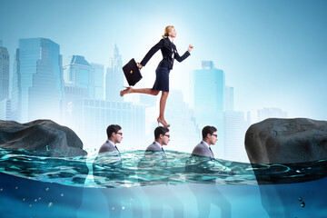 Inequal competition concept with businesswoman walking on heads