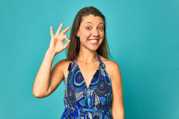 A young caucasian woman isolated cheerful and confident showing ok gesture.