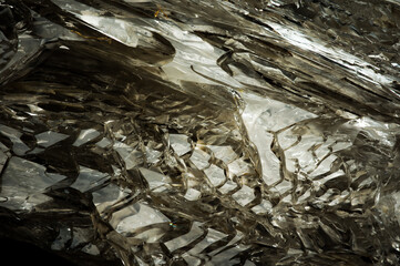fenster elestial window quartz. macro detail texture background. close-up raw rough unpolished semi-precious gemstone