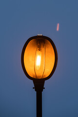 public lighting turned on ahead of time giving a beautiful effect with the blue sky