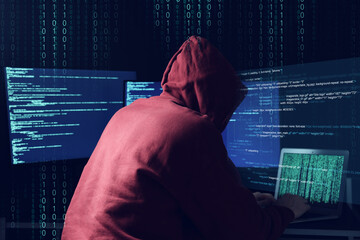 Cyber attack. Anonymous hacker working with laptop and monitors on dark blue background. Binary...
