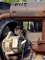 Close-up image of a rusty old engine that appears to be damaged in need of repair.
