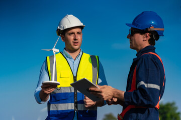Alternative renewable energy and system service, Technician engineer inspection work at wind turbine electricity industrial, green technology for environment by using windmill in power generator farm