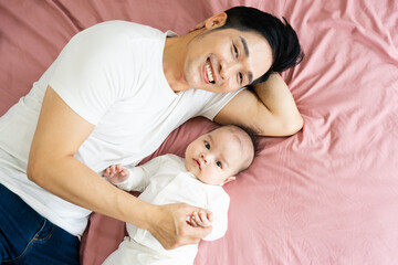 image of asian father and son at home