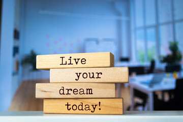 Wooden blocks with words 'Live your dream today'.