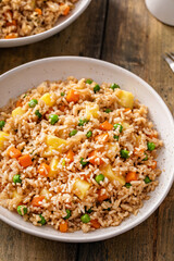 Pineapple fried rice with peas and carrots