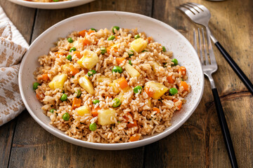 Pineapple fried rice with peas and carrots