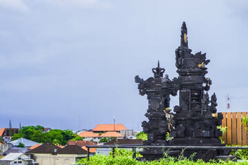 Hindu Temple in Bali, Indonesia. A place to put offerings and pray for Balinese Hindus. Low angle photo with empty blank space for copy and text.