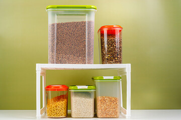 Kitchen shelf with bulk products. Containers for storing rice, cereals. organization of food...