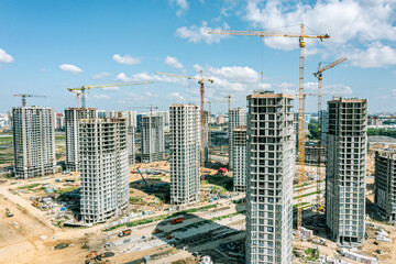 construction site of new apartment complex in city residential area. aerial view from flying drone.