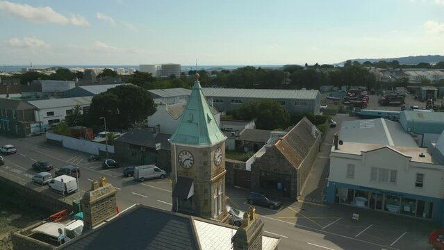 Static aerial drone footage of Clock Tower St Sampson’s harbour Guernsey looking across Southside and beyond