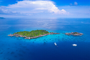 aerial view of the Islands Andaman Sea, with natural blue waters, tropical seas, impressive views of the island's beauty. The island is shaped like a heart.